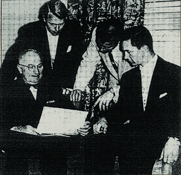 Students Brief Distinguished Guest Before Union Dinner In the music room of the Memorial Student Union before his speech last night, former President Harry S. Truman goes over some last minute details for the dinner with three presidents of the Student Union Activities Board. They are, left to right, Harold Hook, 1952-53; Edwin Werner, 1953-54; and John Collet, 1954-55. Photo and caption courtesy of the Columbia Missourian, April 14, 1954.