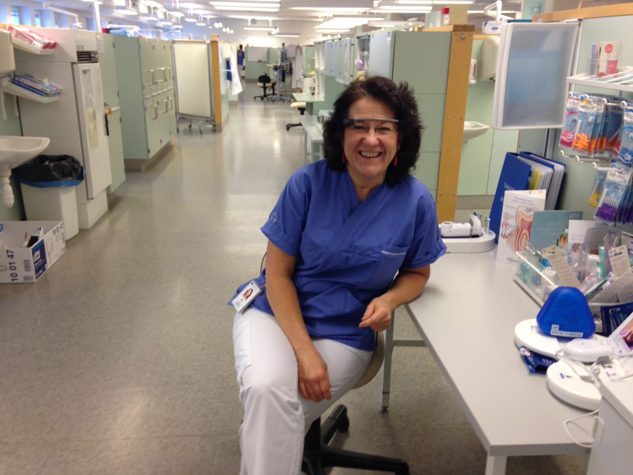 A teacher modeling Google glass in the lab.