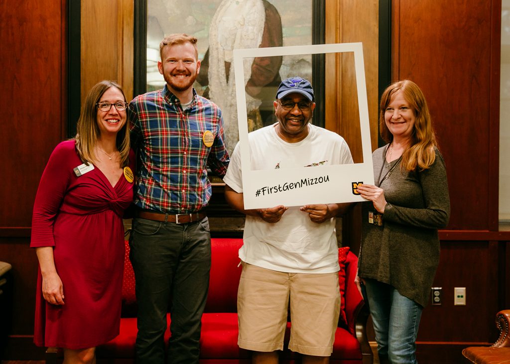 HDFS pizza party for first-generation students, faculty and student posing