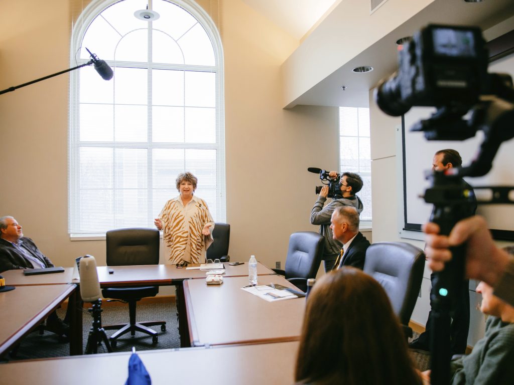 Beth Whitaker in front of cameras